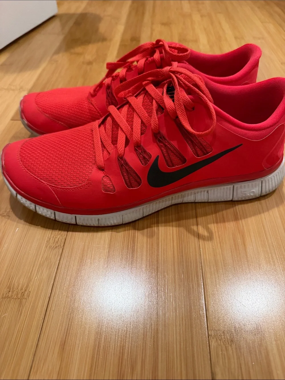 Nike mens Red Athletic Running Shoes with Black Swoosh